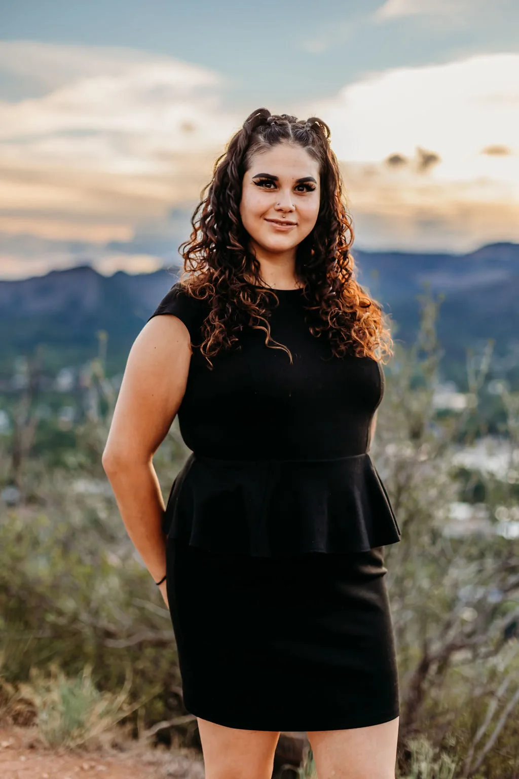 Jackie Garcia, owner of NakedCat Beauty, outdoors in Durango at dusk